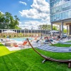 outside green turf area with hammocks